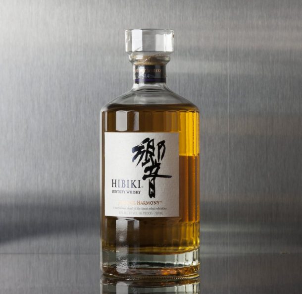 Bottle of Hibiki Harmony on a gray background - best Japanese whisky for cocktails