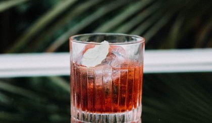 Whisky cocktail in a glass against dark table and dark background - best whisky brands for cocktails