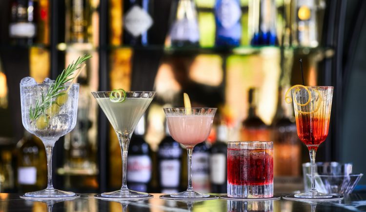 Different cocktails on bar.